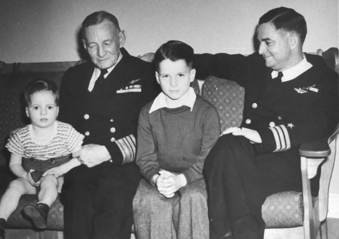 John McCain (center) sits as a young boy with his grandfather Vice Adm.